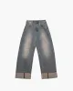 Pantalone in denim a gamba larga sold by Jijil