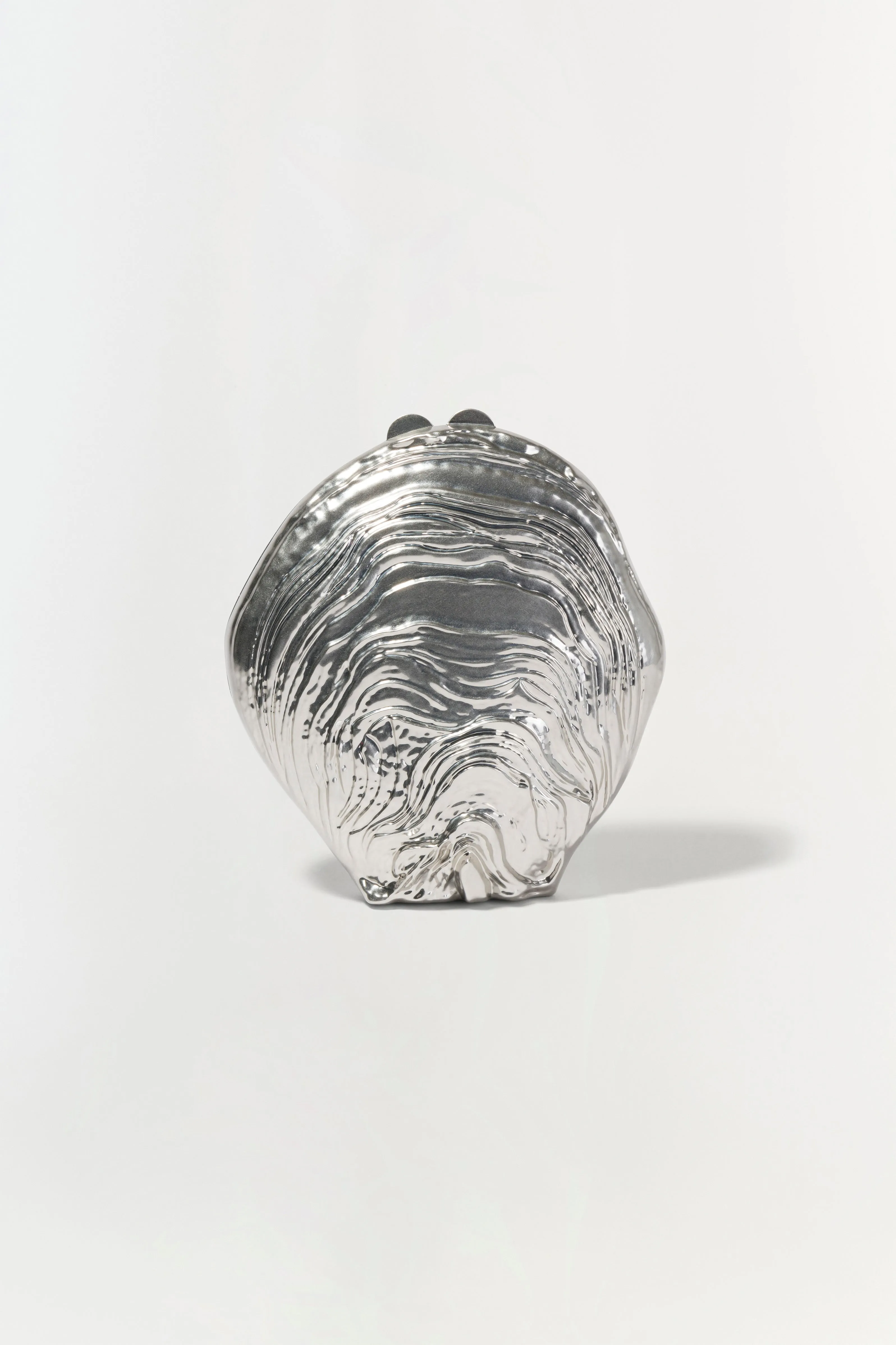 Cove Shell Clutch sold by Jonathan Simkhai