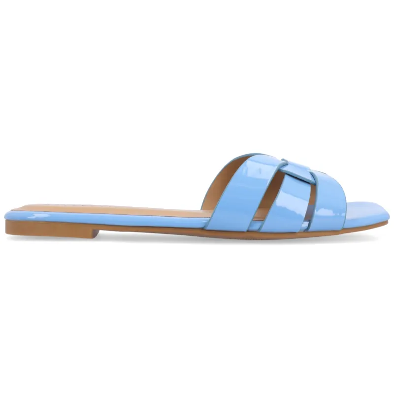 ARRINA STATEMENT PATENT SLIDE SANDALS IN WIDE sold by Journee Collection