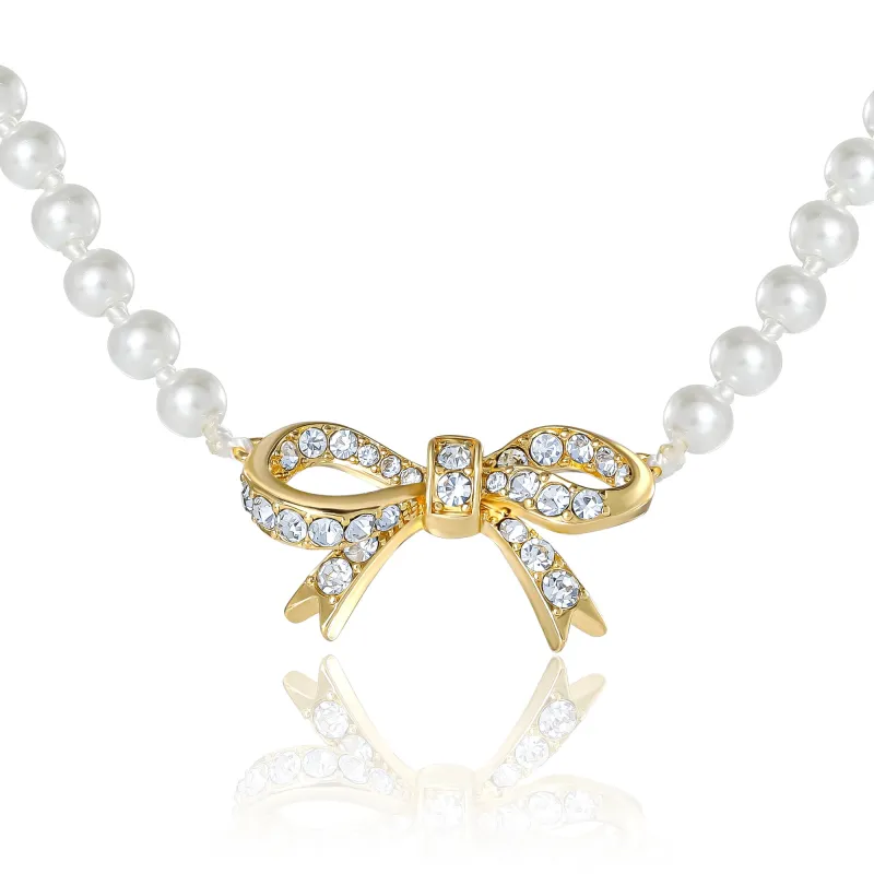 Pearl Necklace with Pavé Bow sold by Juicy Couture