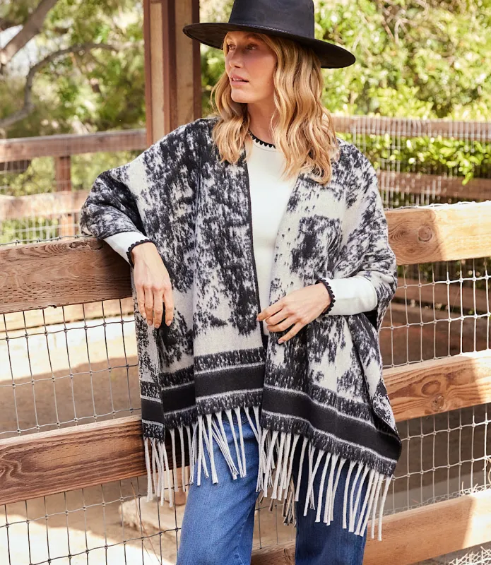 Brushed Jacquard Knit Fringe Poncho sold by Karen Kane