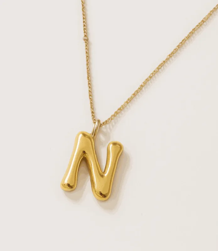 Gold Bubble Letter Charm Necklace sold by Karen Kane