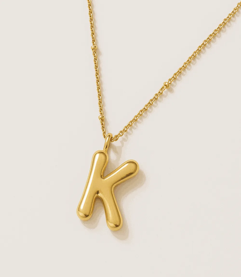 Gold Bubble Letter Charm Necklace sold by Karen Kane