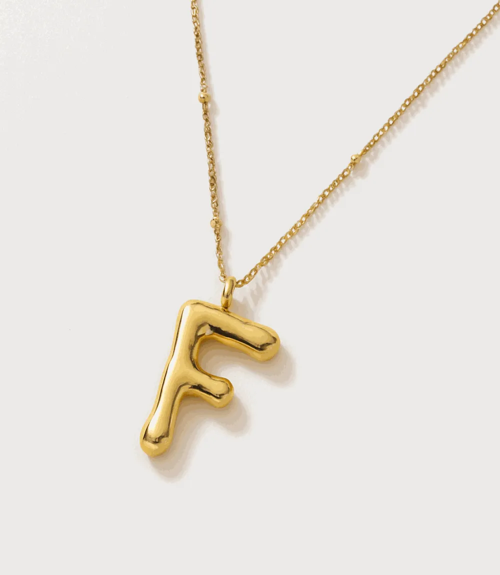 Gold Bubble Letter Charm Necklace sold by Karen Kane