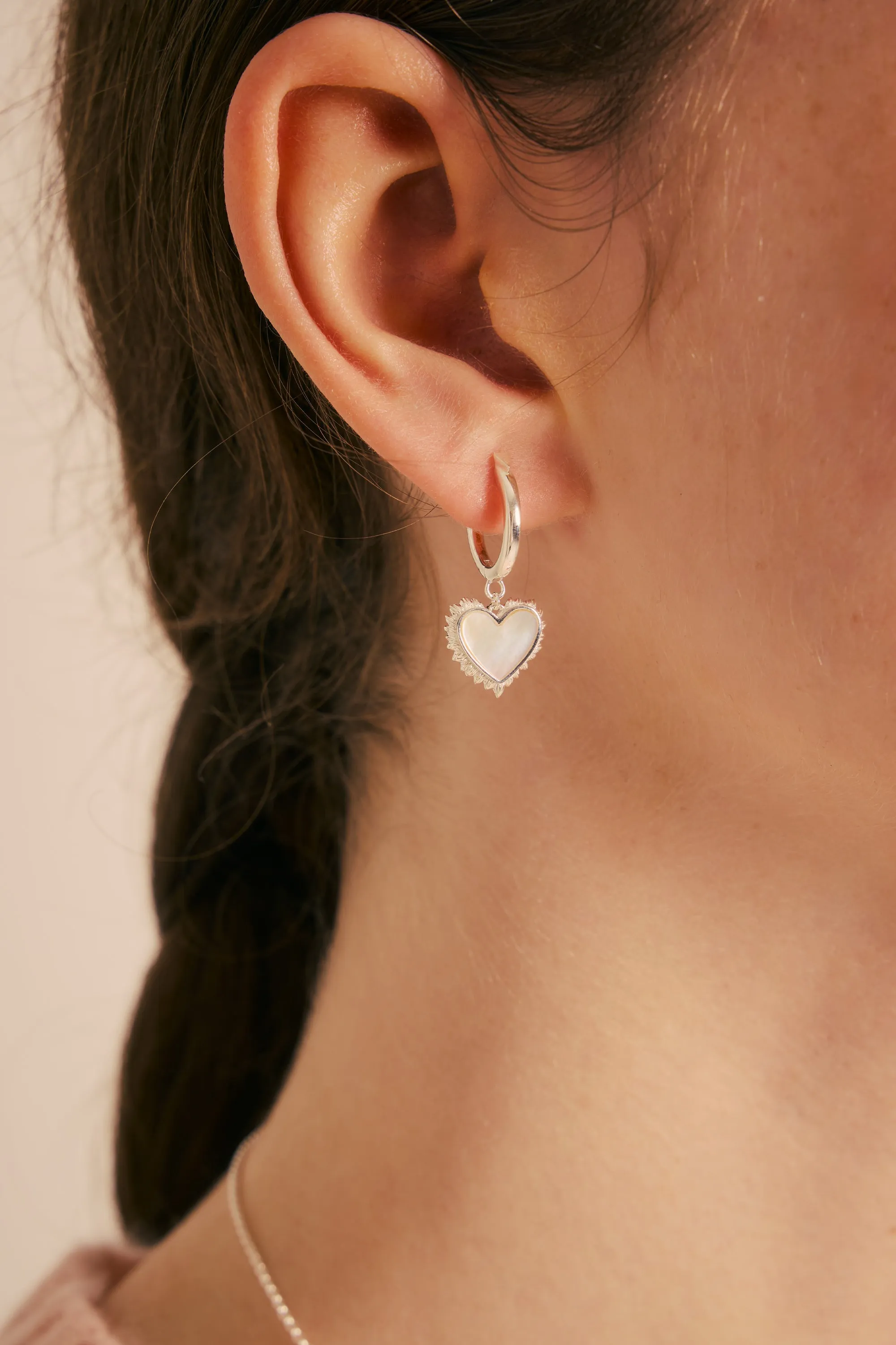 Flaming Mother-of-Pearl Hoops Silver sold by Karen Walker