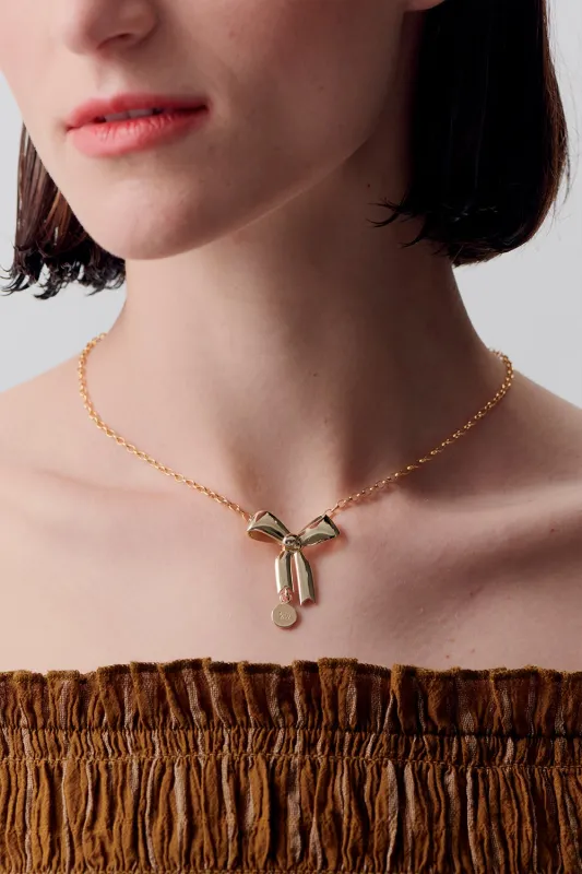 Bow Pendant Gold sold by Karen Walker