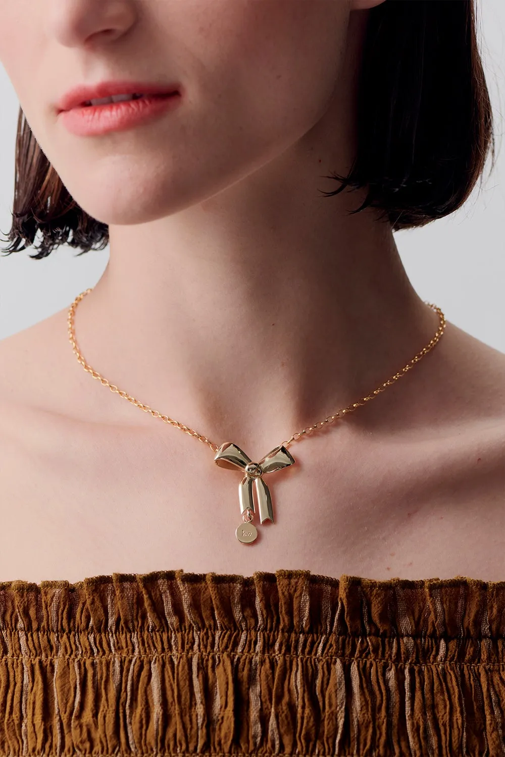 Bow Pendant Gold sold by Karen Walker