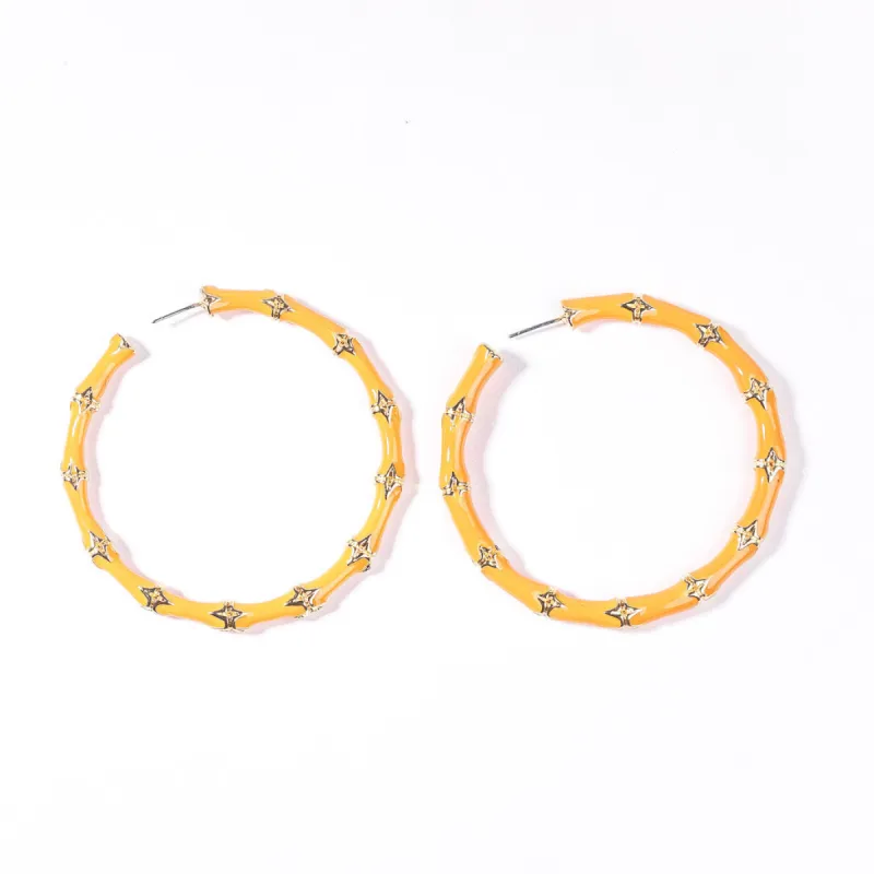 Large Coral Bamboo Pierced Hoop Earrings sold by Kenneth Jay Lane