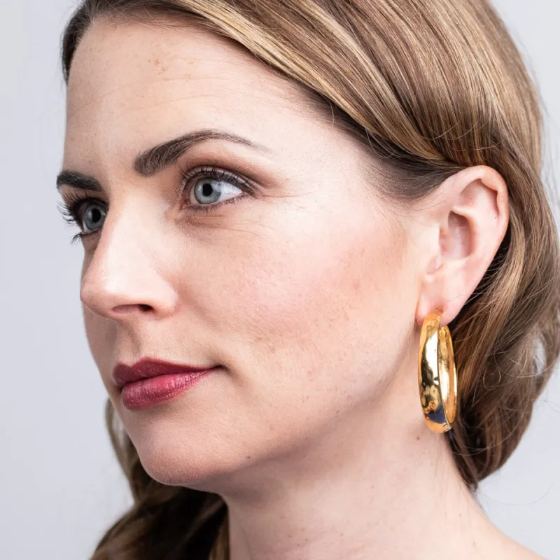 Polished Gold Tapered Hoop Pierced Earrings sold by Kenneth Jay Lane