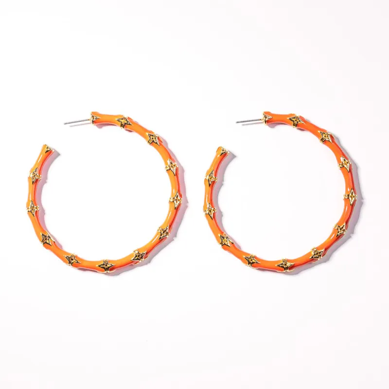 Large Coral Bamboo Pierced Hoop Earrings sold by Kenneth Jay Lane
