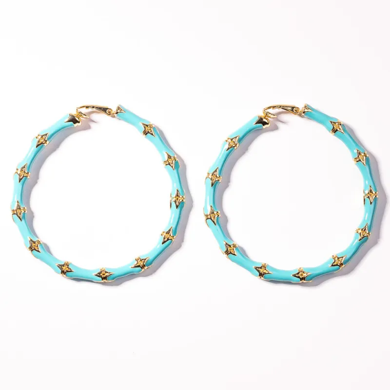 Large Turquoise Bamboo Clip-On Hoop Earrings sold by Kenneth Jay Lane