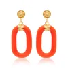 Polished Gold & Coral Resin Drop Earrings sold by Kenneth Jay Lane