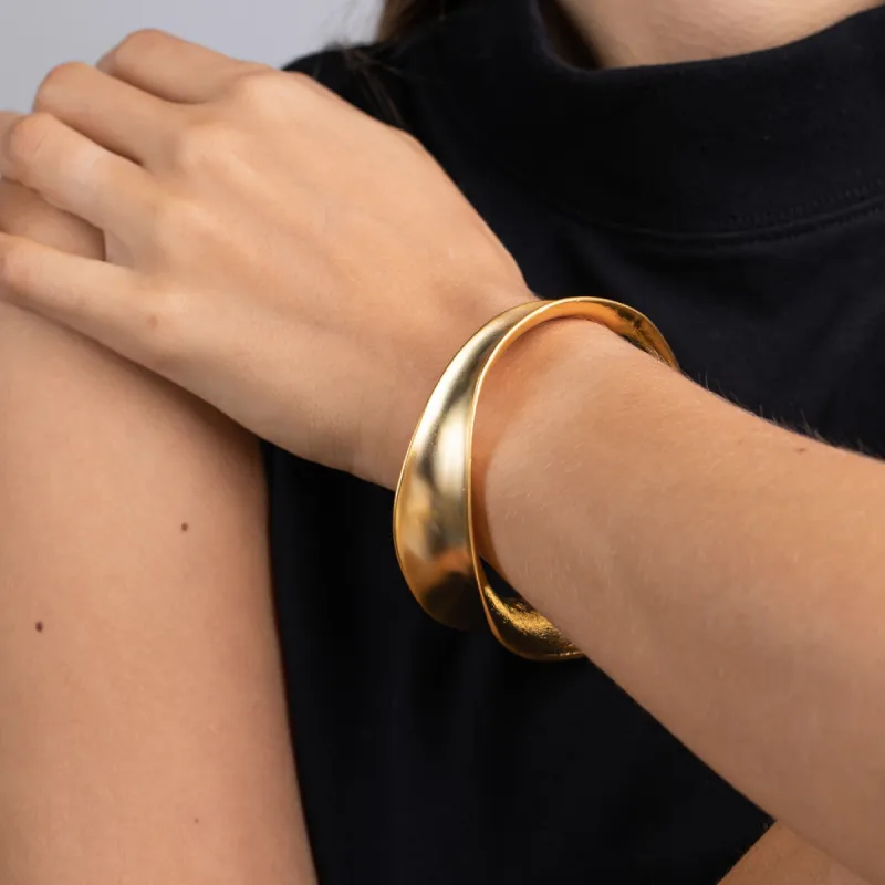 Satin Gold Wavy Contoured Bangle sold by Kenneth Jay Lane