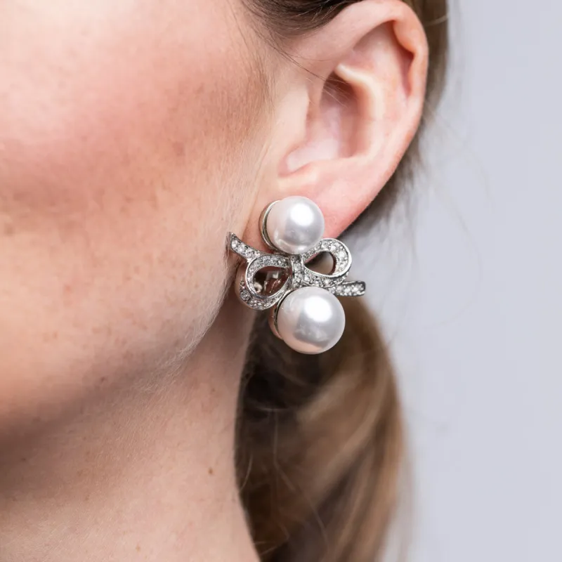 Silver and Crystal Double Pearl Bow Clip Earrings sold by Kenneth Jay Lane