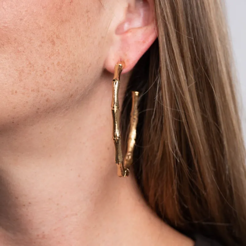 Large Gold Bamboo Hoop Pierced Earrings sold by Kenneth Jay Lane