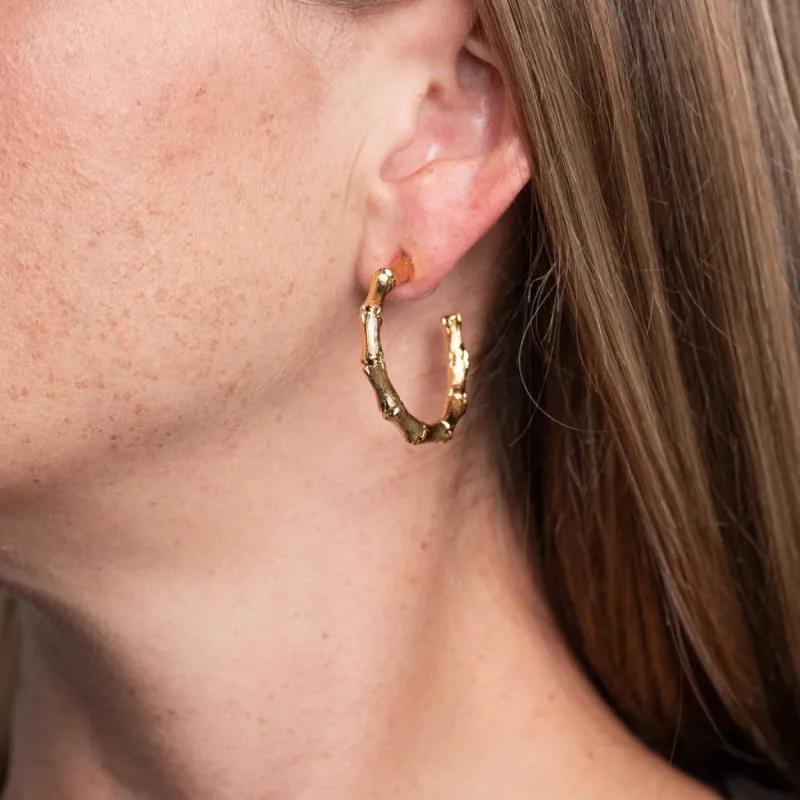Small Gold Bamboo Hoop Pierced Earrings sold by Kenneth Jay Lane