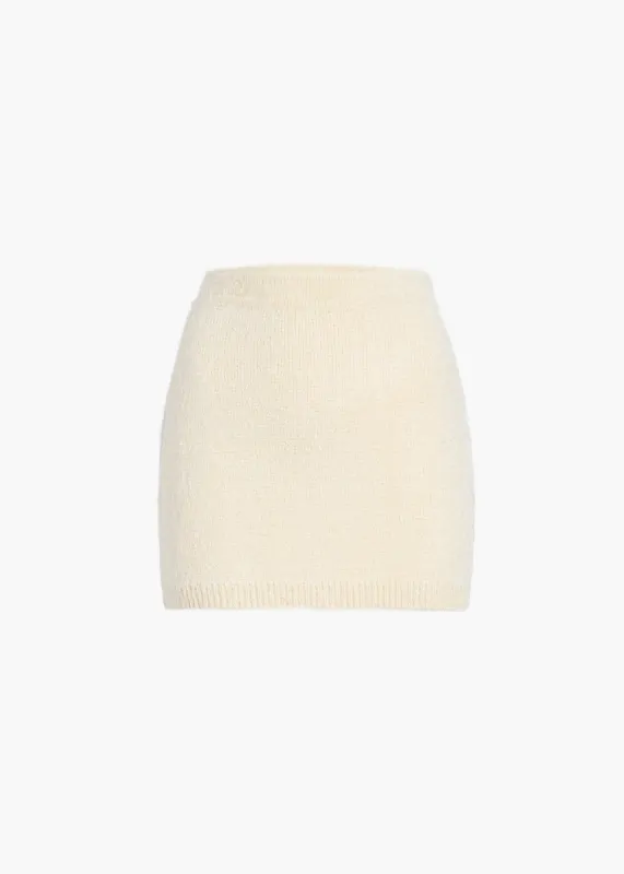 Darrion Skirt in Cream sold by KHAITE