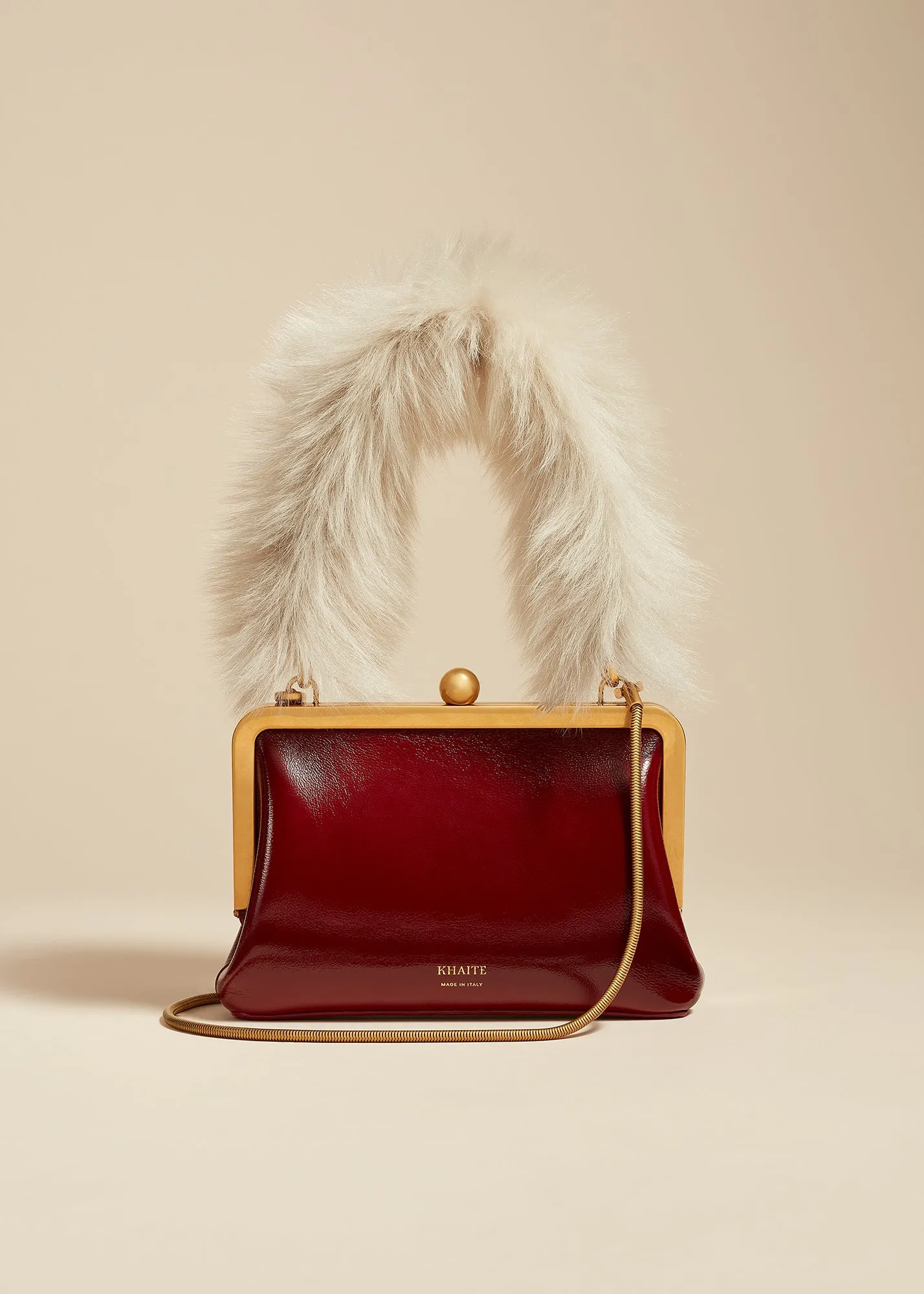 Small Lilith Evening Bag in Oxblood Crackle Patent Leather with Shearling sold by KHAITE