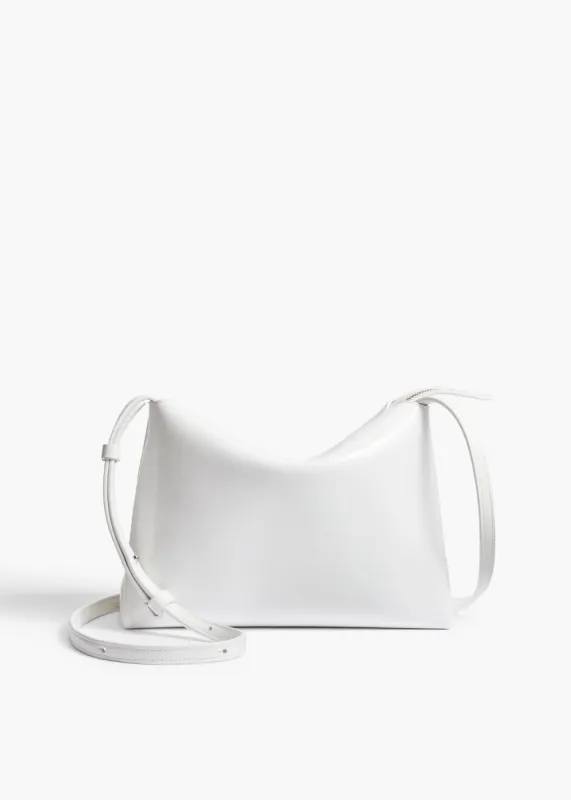 Lina Crossbody Bag in Optic White Crackle Patent Leather sold by KHAITE