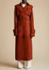The Rennie Trench in Rust Suede sold by KHAITE