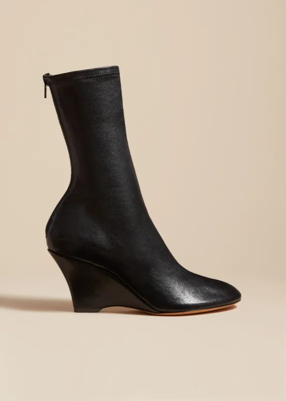 The Apollo Wedge Boot in Black Leather sold by KHAITE