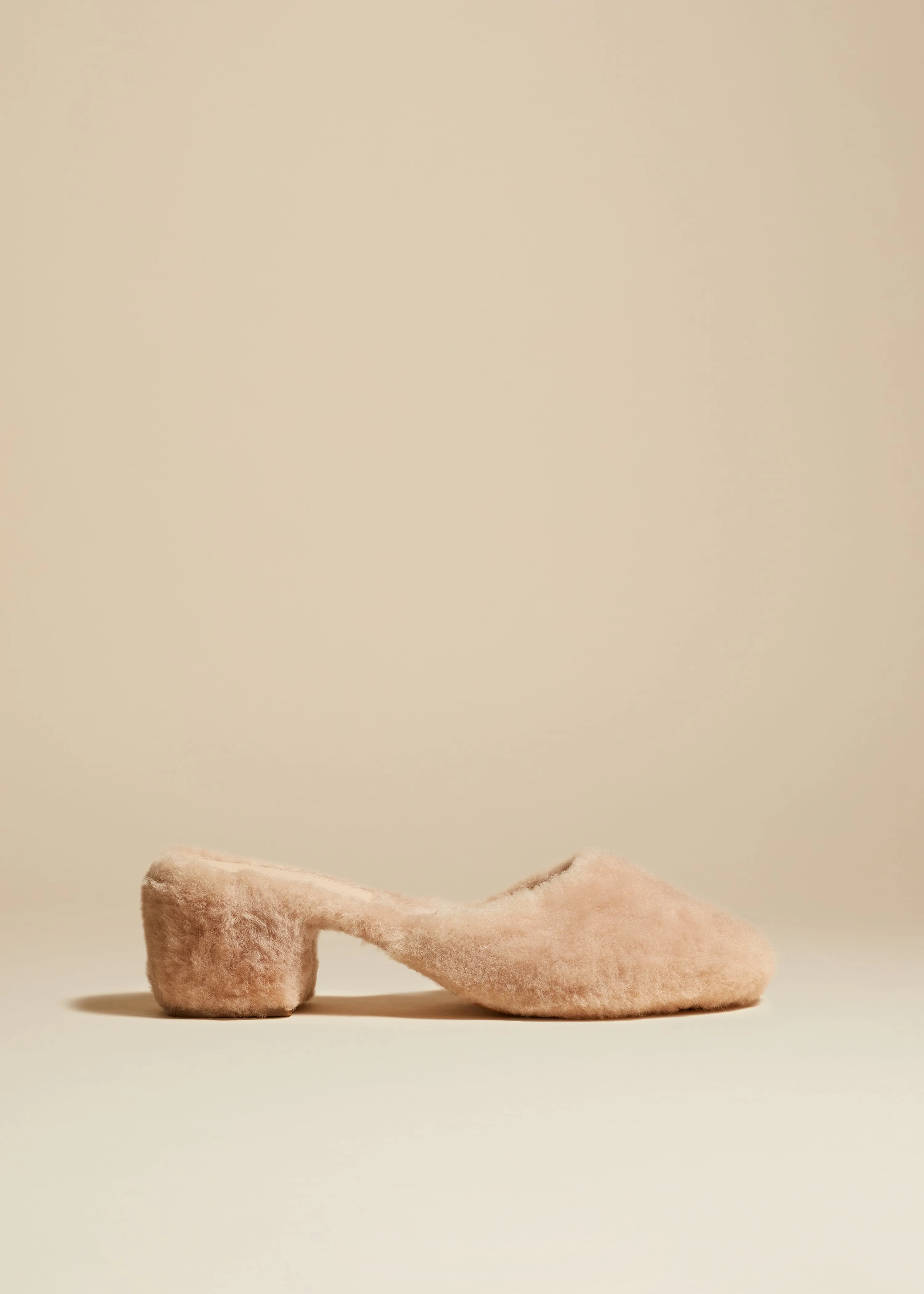 The Clio Mule in Blush Shearling sold by KHAITE