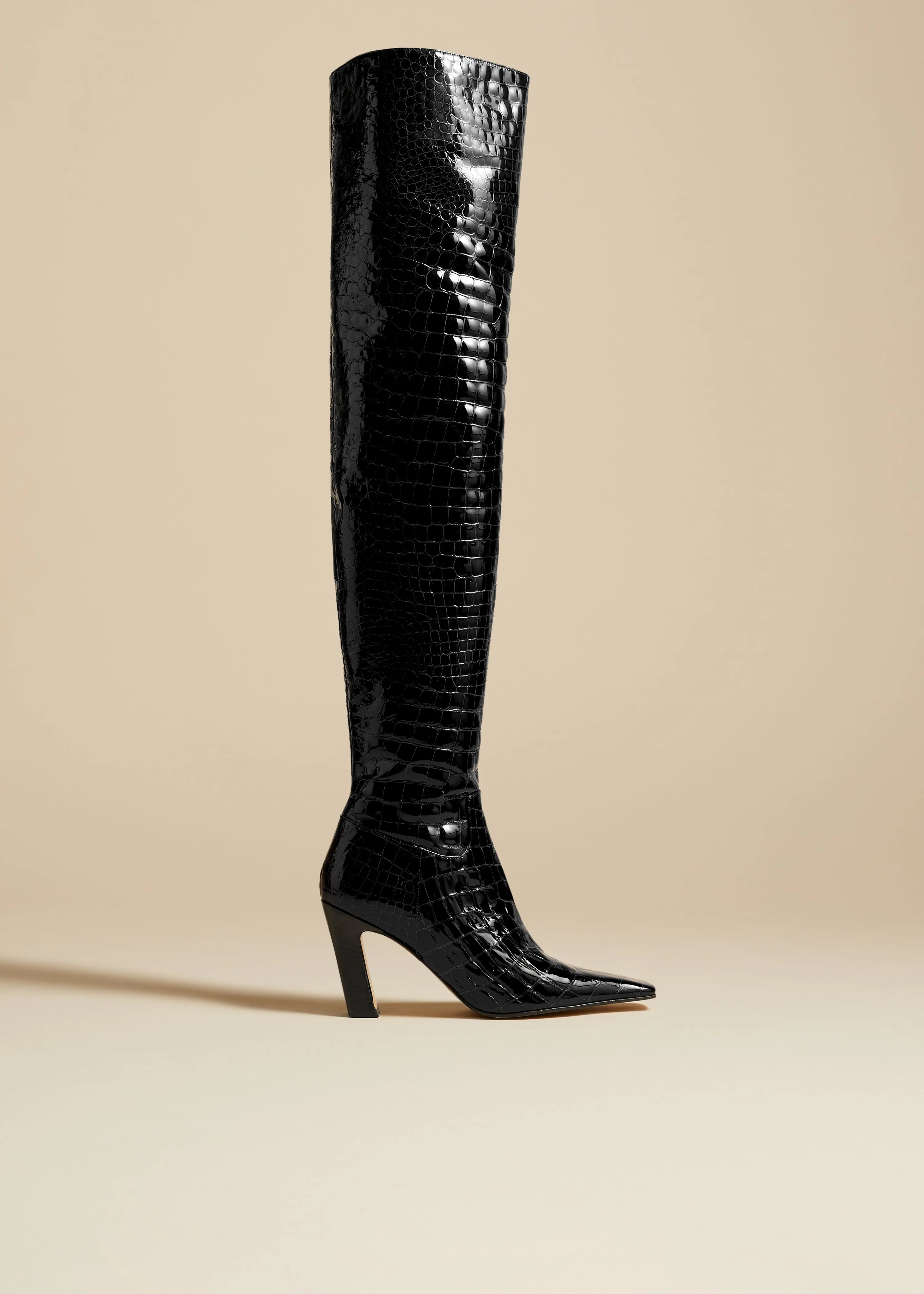 The Marfa Over-the-Knee High Boot in Black Croc-Embossed Leather sold by KHAITE