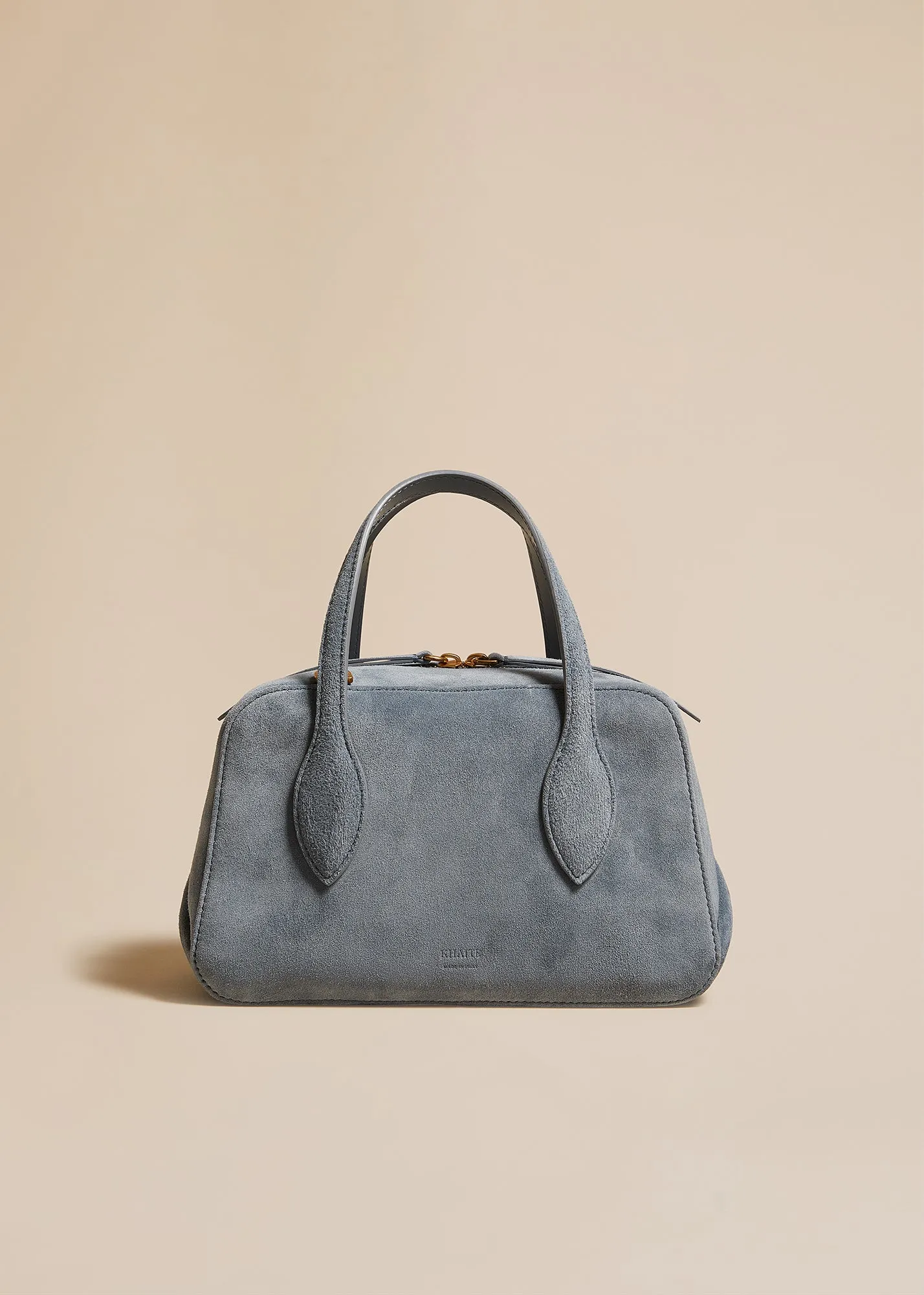 The Small Maeve Crossbody Bag in Lead Suede sold by KHAITE