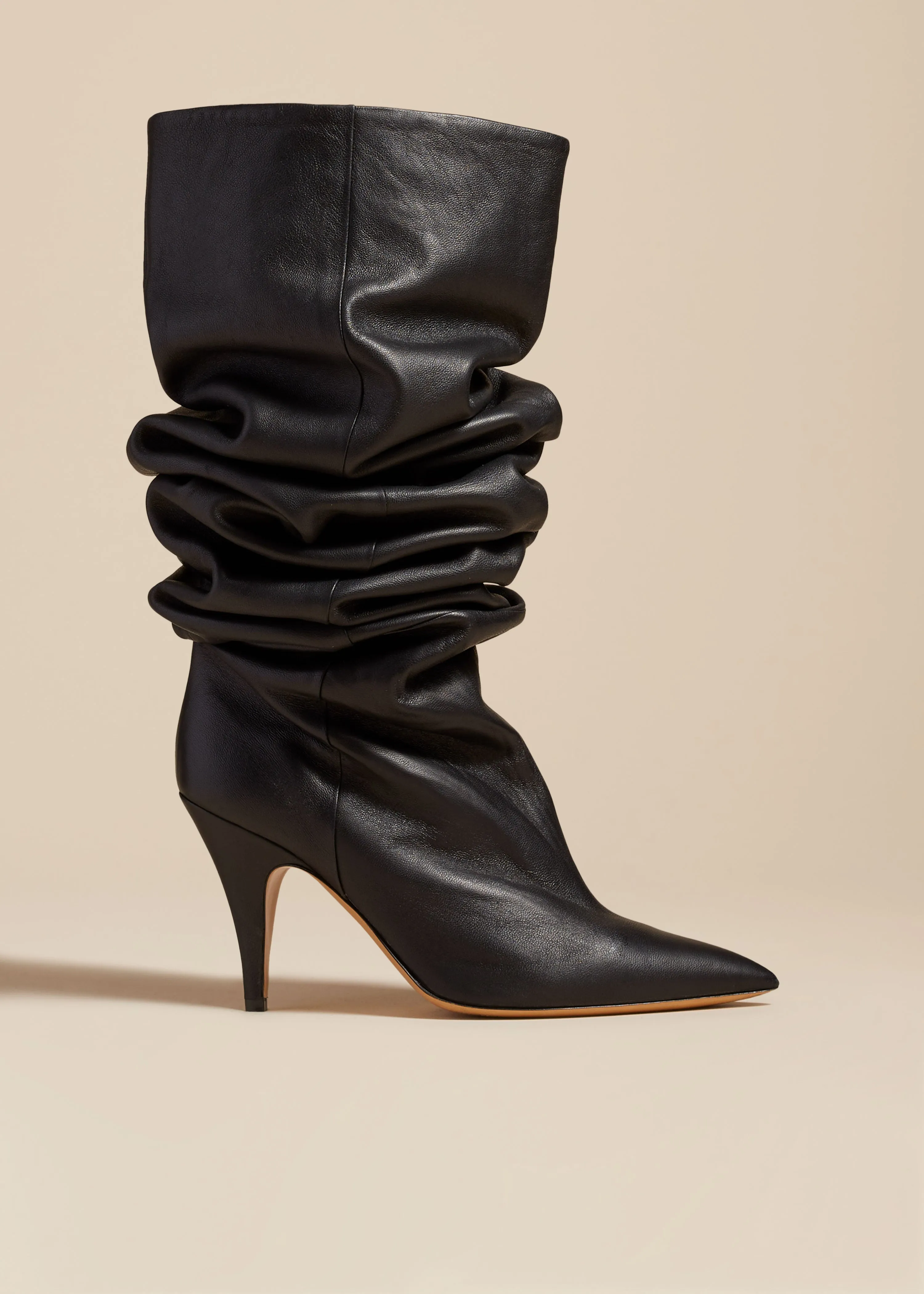 The River Knee-High Boot in Black Leather sold by KHAITE