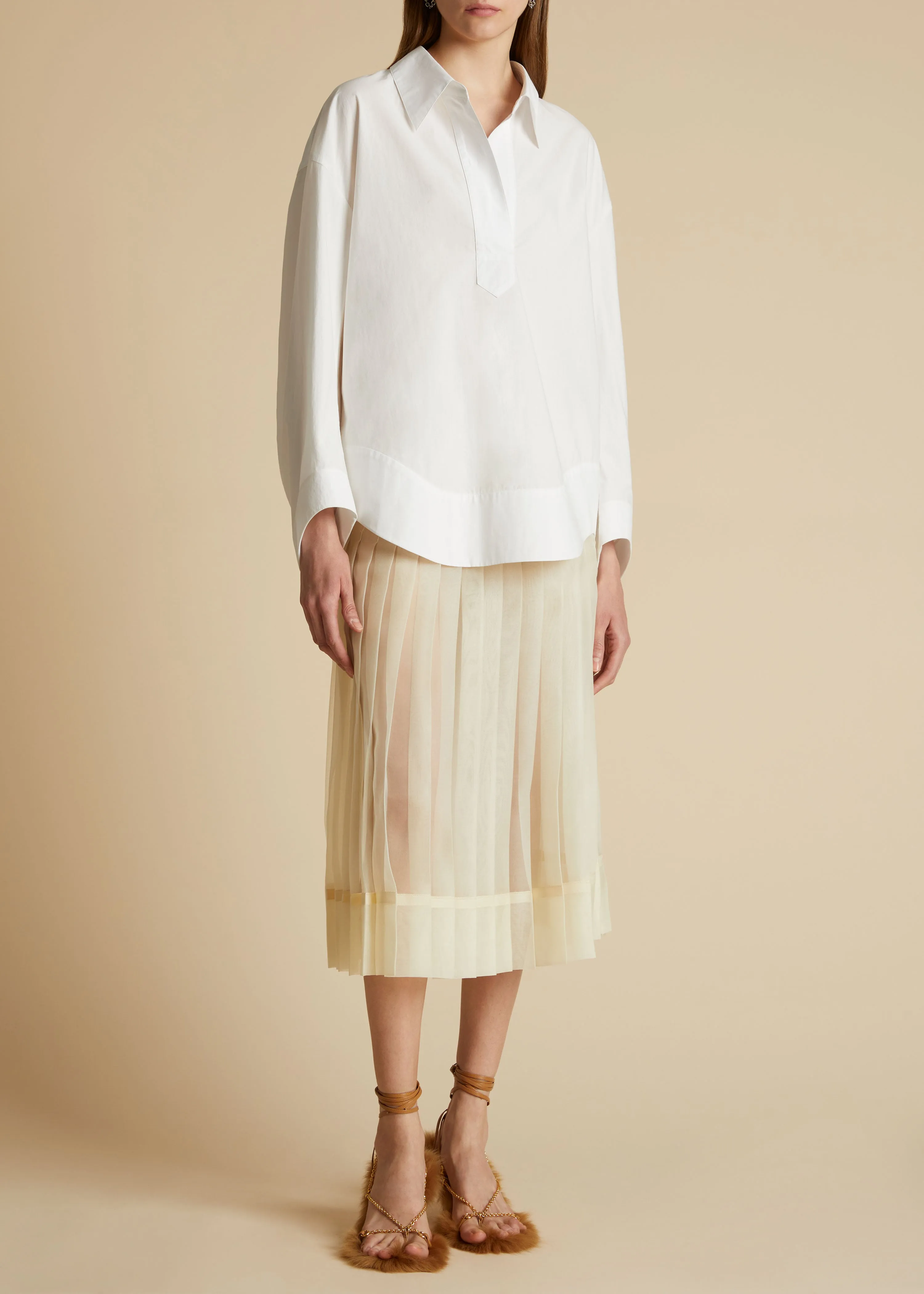 The Tudi Skirt in Cream sold by KHAITE