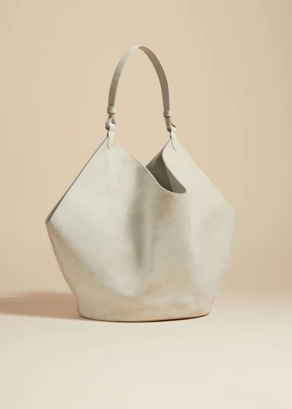 The Medium Lotus Tote in Grey Suede sold by KHAITE