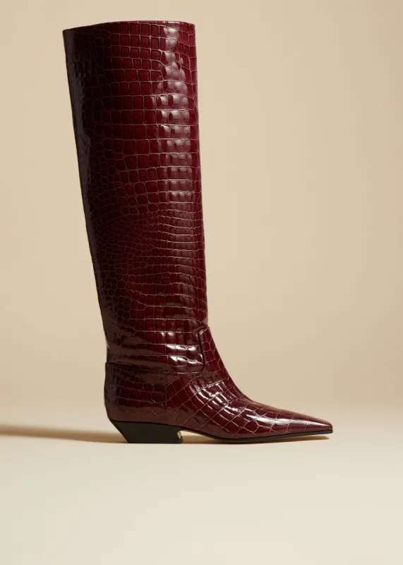 The Marfa Knee-High Boot in Bordeaux Croc-Embossed Leather sold by KHAITE