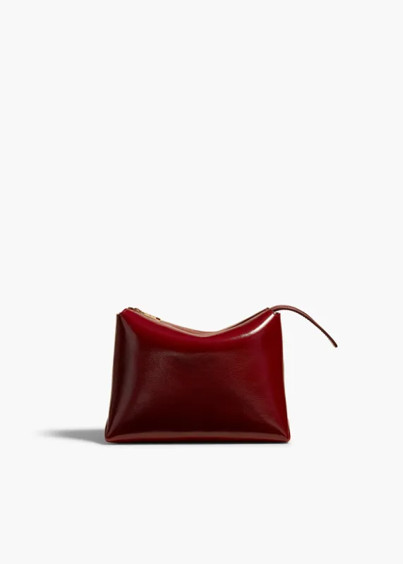 Lina Pochette in Oxblood Crackle Patent Leather sold by KHAITE
