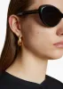 Small Olivia Hoop Earrings in Gold sold by KHAITE