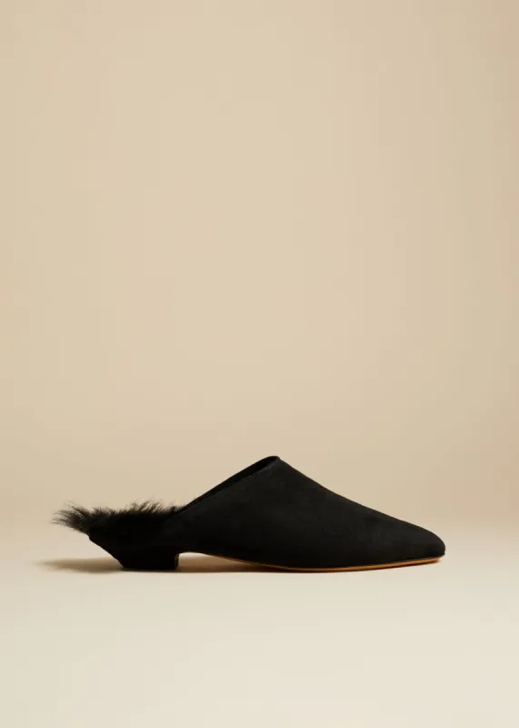The Otto Mule in Black Suede with Shearling sold by KHAITE