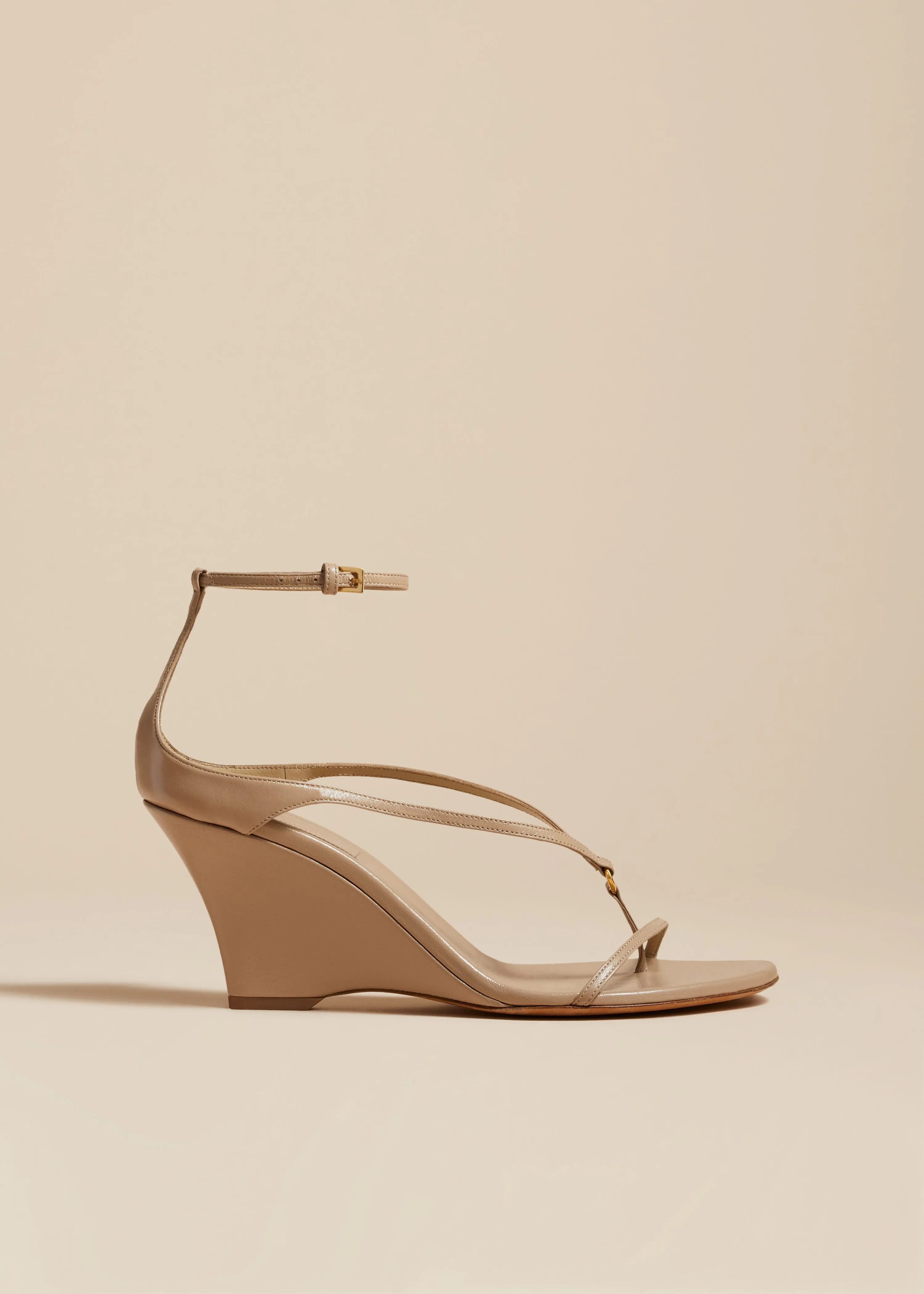 Marion Strappy Wedge Sandal in Beige Leather sold by KHAITE