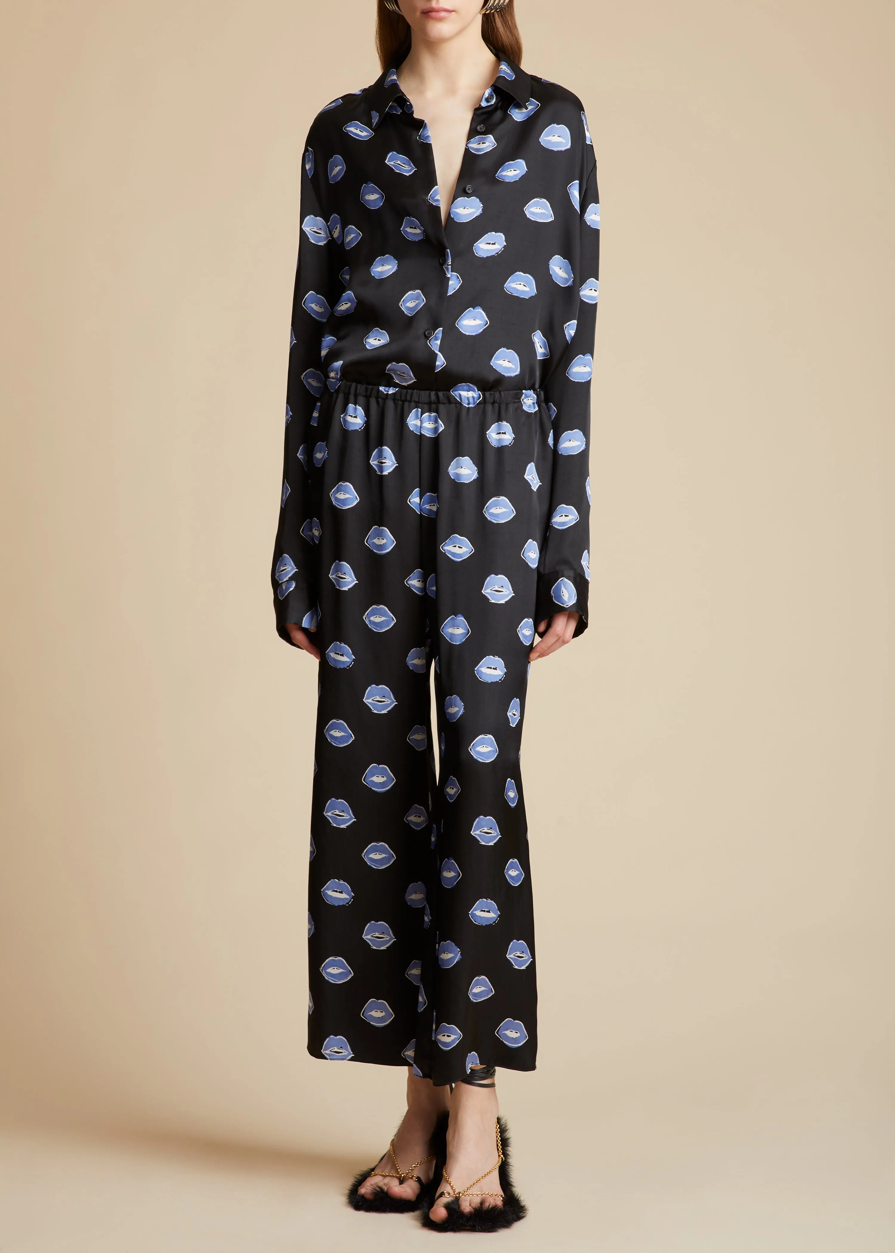 The Mindy Pant in Black with Cornflower Lip Print sold by KHAITE