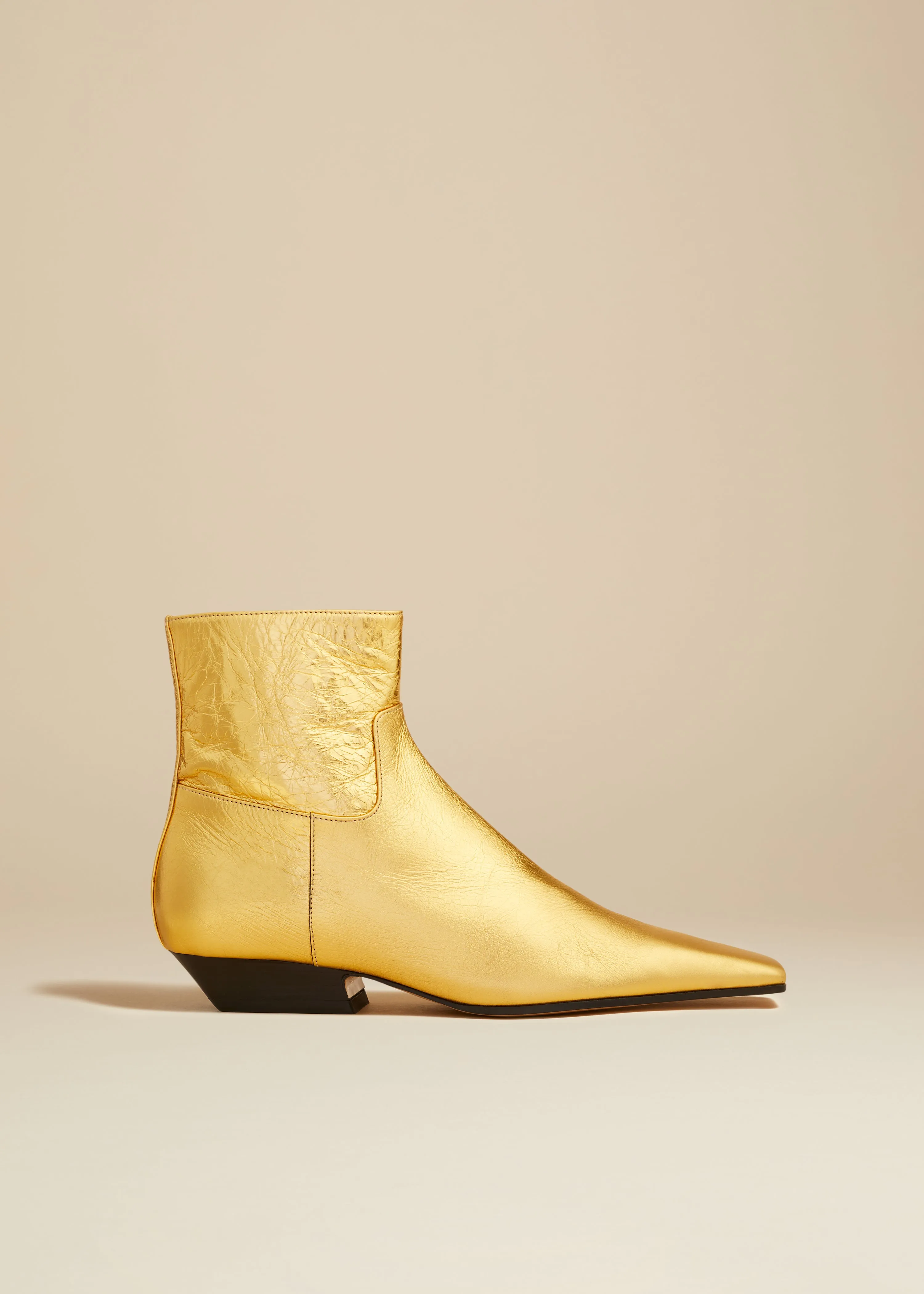 The Marfa Ankle Boot in Gold Metallic Leather sold by KHAITE