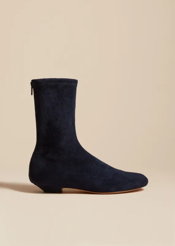 The Apollo Flat Ankle Boot in Midnight Suede sold by KHAITE