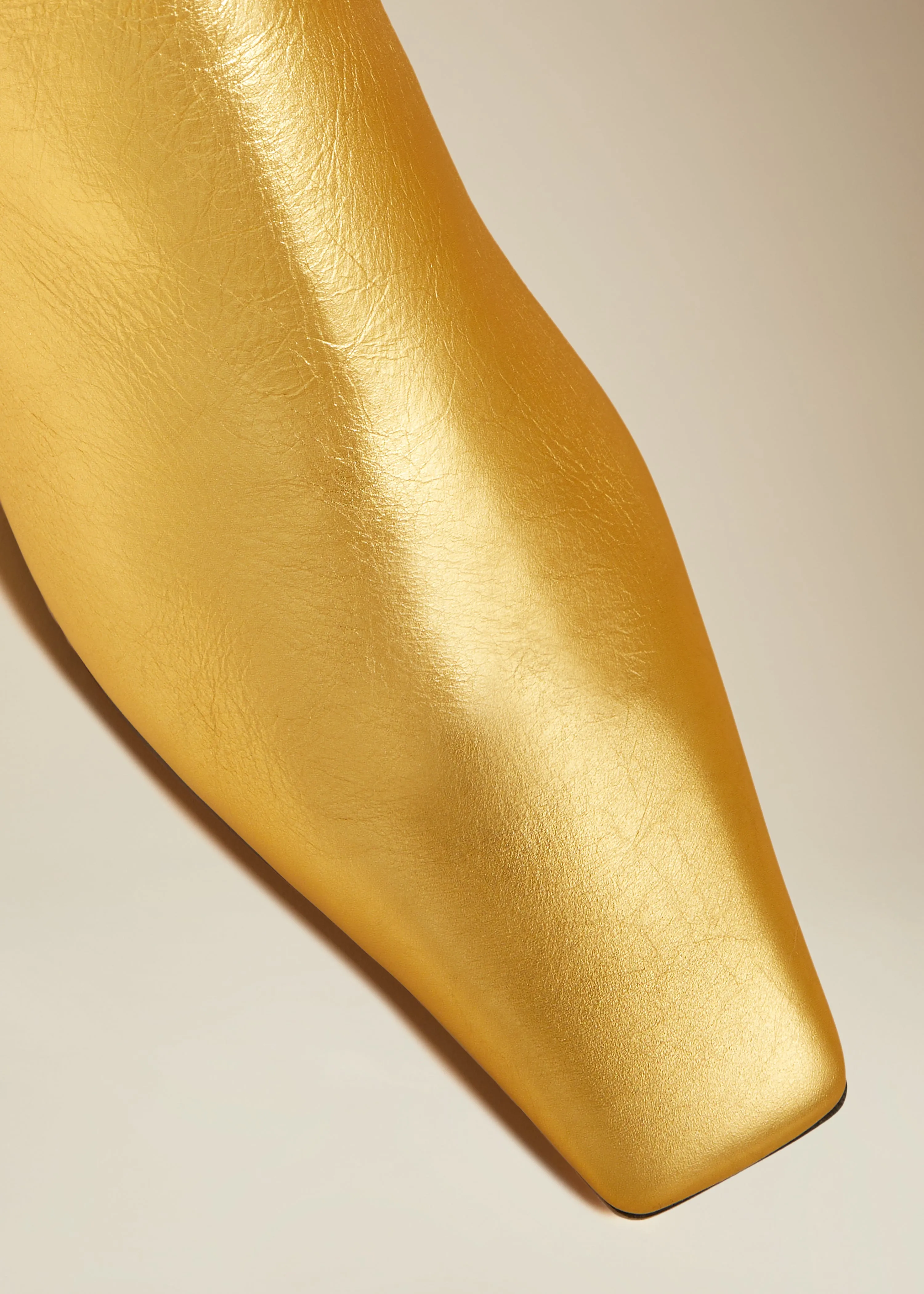 The Marfa Over-the-Knee Flat Boot in Gold Metallic Leather sold by KHAITE product image thumbnail 4