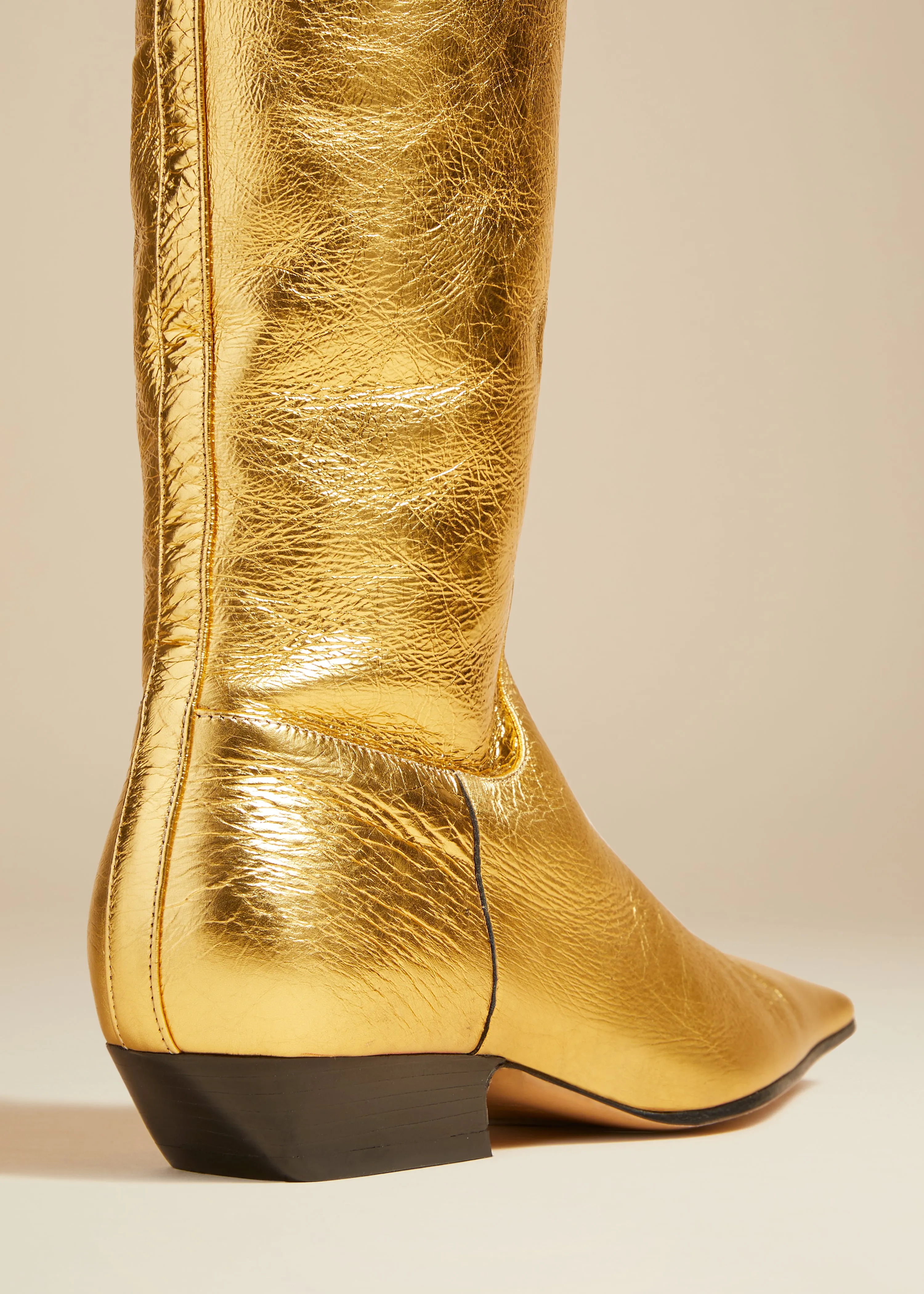 The Marfa Over-the-Knee Flat Boot in Gold Metallic Leather sold by KHAITE product image thumbnail 3