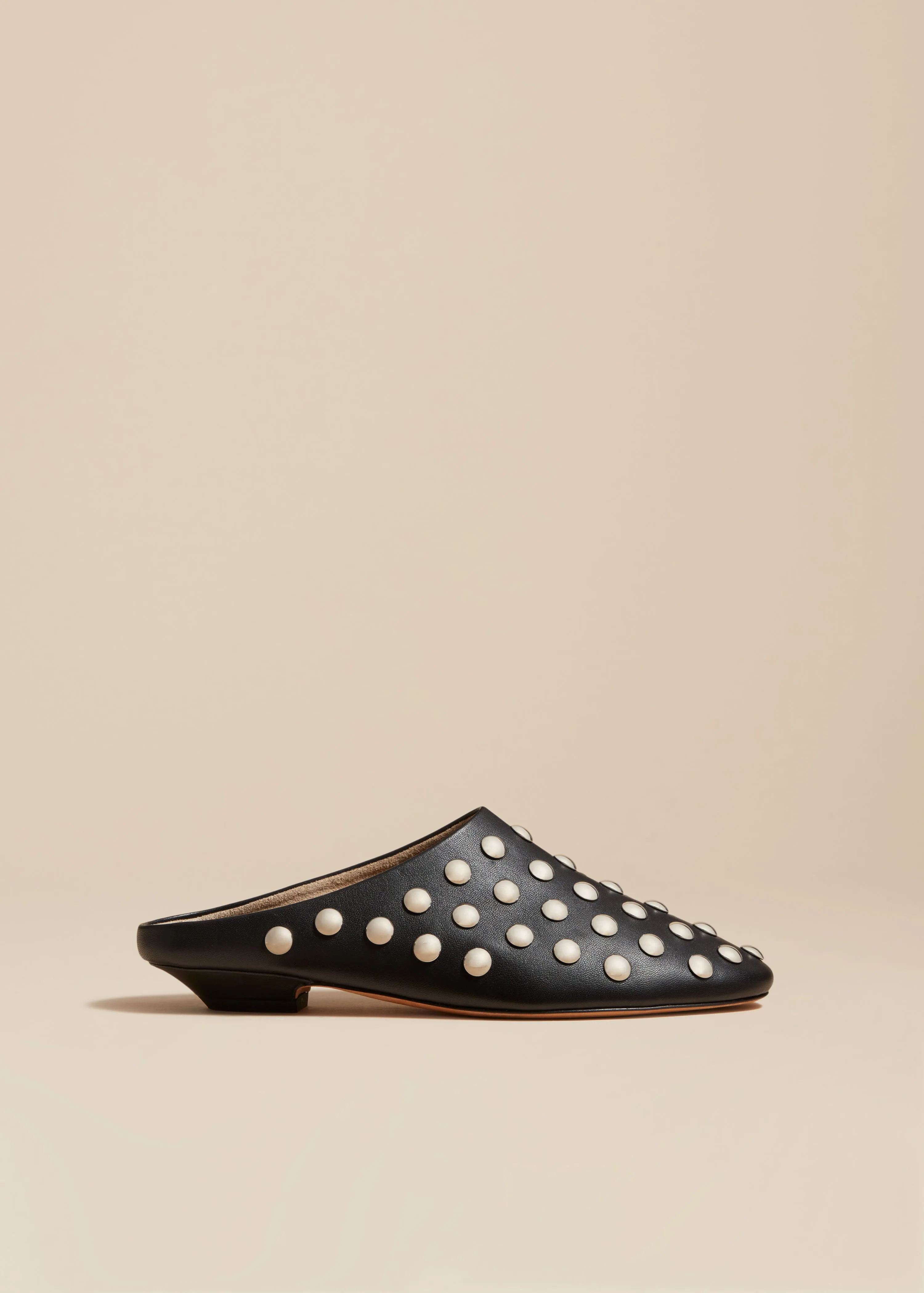 Otto Mule in Black Leather with Studs sold by KHAITE