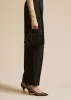 The Small Maeve Crossbody Bag in Black Suede sold by KHAITE