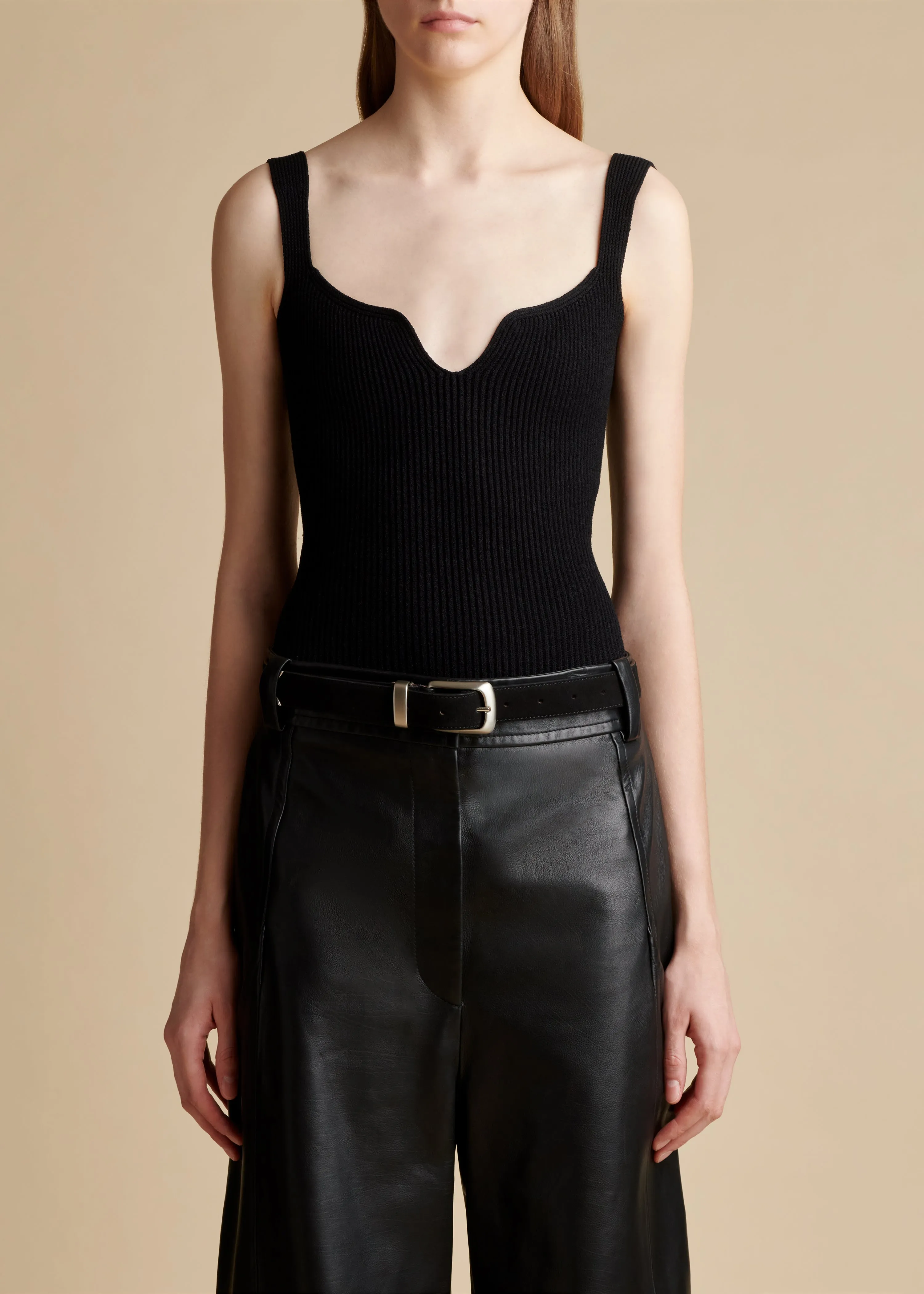 The Yves Bodysuit in Black sold by KHAITE