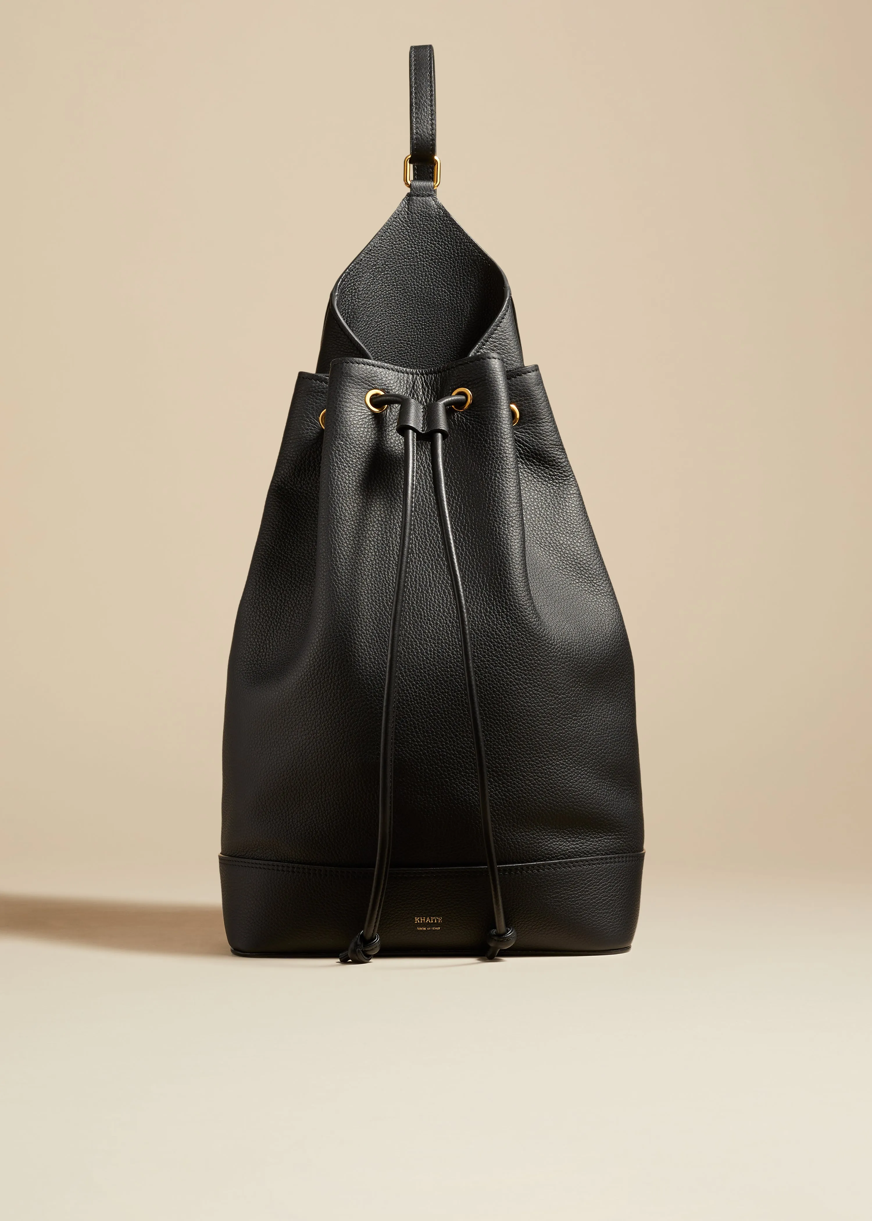 The Medium Greta Backpack in Black Pebbled Leather sold by KHAITE