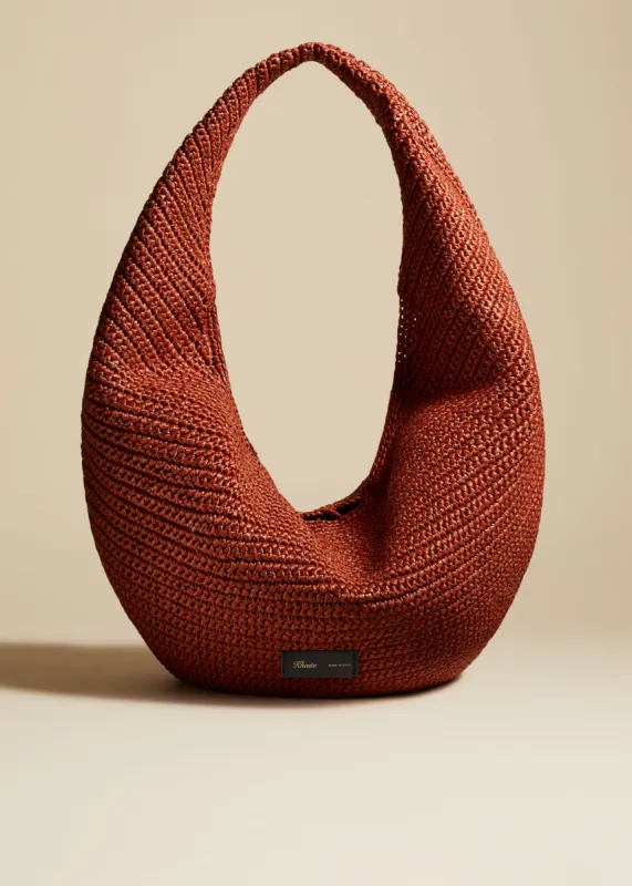 Large Olivia Hobo in Redwood Raffia sold by KHAITE
