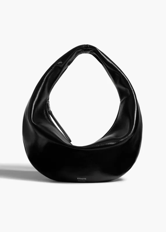 Medium Olivia Hobo in Black Crackle Patent Leather sold by KHAITE