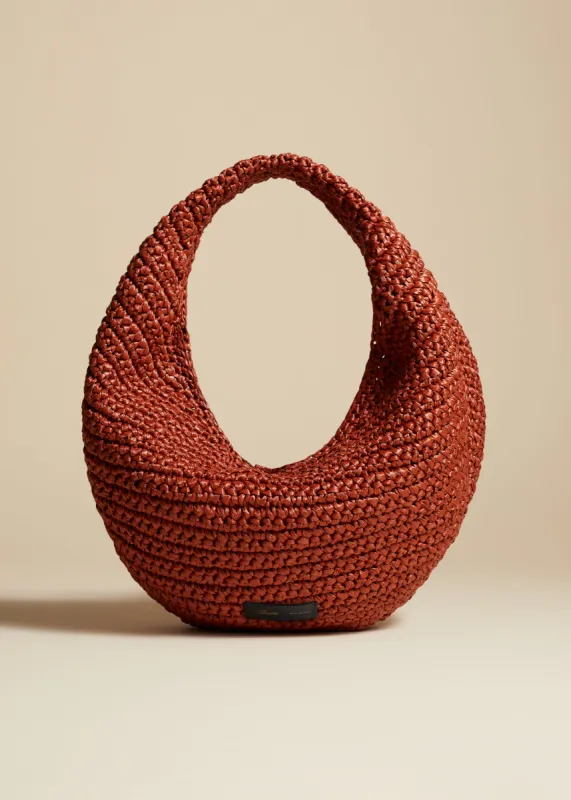 Medium Olivia Hobo in Redwood Raffia sold by KHAITE