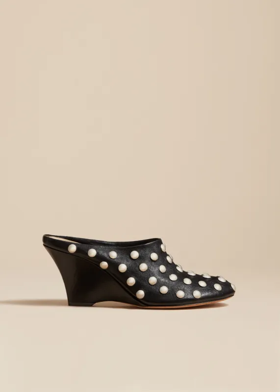 The Apollo Wedge Mule in Black Leather with Studs sold by KHAITE