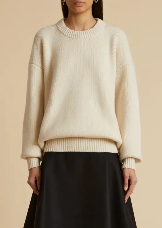 The Corso Sweater in Magnolia sold by KHAITE